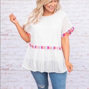 Poms Away top with a free bracelet